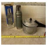 Stanley rusted thermos and pressure pot.