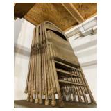 Seven metal fold up chairs.