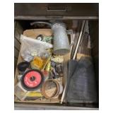 Oil can, saw blades and electrical supplies.