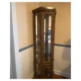 Lighted glass shelf curio cabinet measures 25