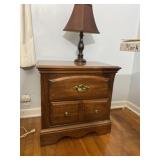 Nightstand with lamp.