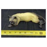 Siamese cat figurine.