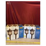Two new in boxes bright amber solar lights.