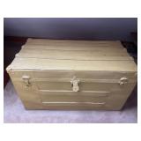 Vintage steamer trunk with blankets