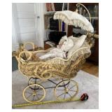 Victorian era baby buggy with porcelain doll.