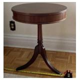 Mahogany Duncan Phyfe round drum side table and a