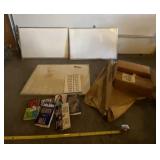 Dry erase boards with cover and books.