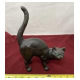 Cast iron cat door stop.