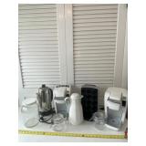Two Keurig coffee makers and holder, glass