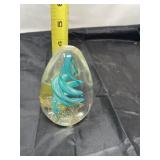 art glass paperweight featuring a turquoise or