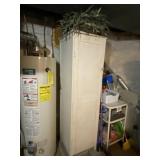 Wood storage cabinet with contents.