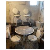Wrought iron table witu four cushioned chairs