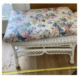 Wicker stool with cushion.