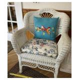 Wicker chair with cushion and pillow