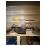 All contents on three shelves including cake