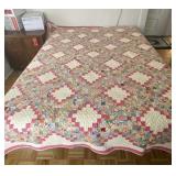 92 x 75 pink and white quilt.