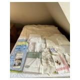 Table cloths, kitchen towels and comforter.
