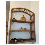 Wicker hanging shelf and contents on shelf.