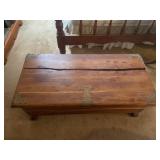 Cedar chest with brass corner pieces has cracked
