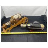 Wooden bottle holder and a sealed bottle of