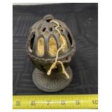 Cast iron string holder.