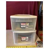 Two Sterlite plastic storage containers with kids