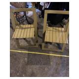 Two wooden fold up chairs.