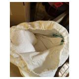 Bag full of bedding, bedspread, bed comforter