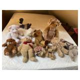 Stuffed animals, including Thai beanie baby, and