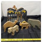 Wood circus animals and cart on wheels.