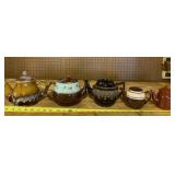 Older teapots including brown enamel teapot.