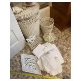 Bathroom towels, mirror, wicker basket trash can,