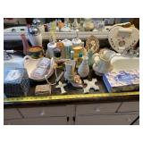 All decor and bathroom supplies on counter.