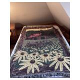Two throw blankets, one with sunflower barn