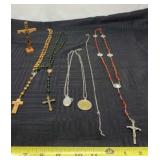 Rosaries and Jesus on cross.