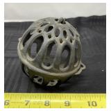 Cast iron string holder.