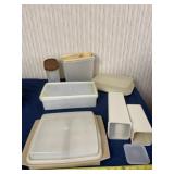 Tupperware egg dish, and containers with lids.