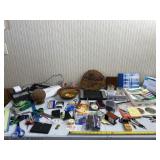 Office supplies including envelopes, pens, desk