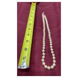 vintage-style hand-knotted pearl necklace. With