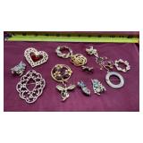 Gold tone brooches with rhinestones