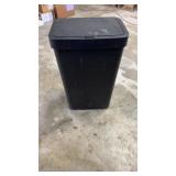 Motion sensor plastic trash can in black.