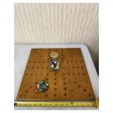 Marble board and marbles.