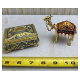 Ornate gold tone trinket box and camel.