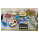 Plastic cups, bowls, plates and silverware with