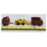 Baler, forage wagon and loader scale toys.