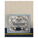 Welcome hanging sign.