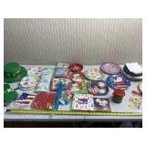 Different Holiday plates and napkins .