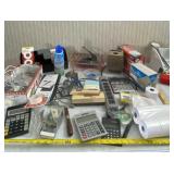 Office supplies including envelopes, calculators,