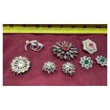 Silvertone brooches with rhinestones