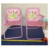 Two little girls pink fold up Disney chairs.